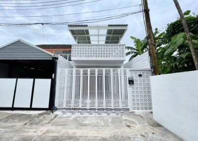 Modern white house with gate
