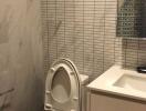 Modern bathroom with tiled walls and a marble accent wall