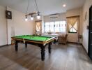 Recreational room with a pool table and seating area