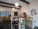 Spacious kitchen with a large island, wooden beams, and decorative plates