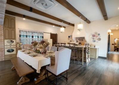 Spacious and well-lit dining area with a stylish rustic decor