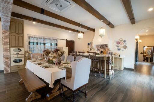 Spacious and well-lit dining area with a stylish rustic decor