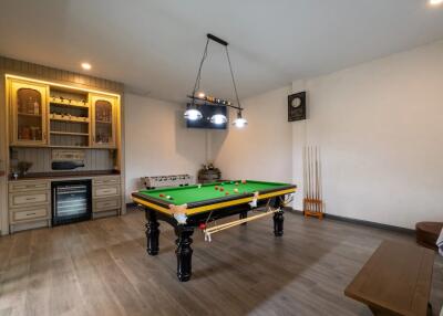 Recreation room with a billiards table