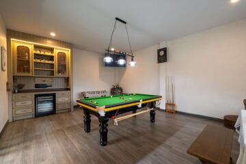 Recreation room with a billiards table