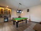 Recreation room with a billiards table