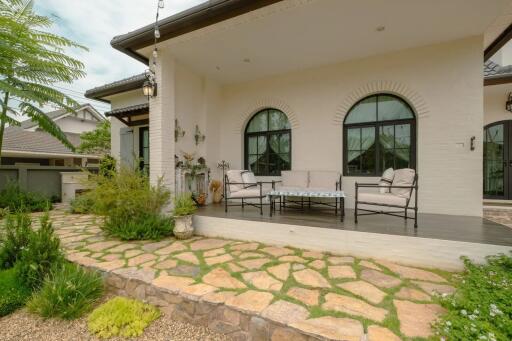 Exterior view of a house with a porch and garden