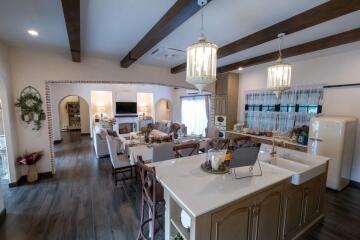 Open concept kitchen and living room with modern and rustic elements