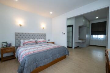 Spacious bedroom with modern decor and en suite bathroom