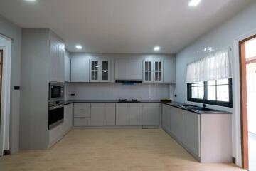 Modern kitchen with built-in appliances and ample counter space