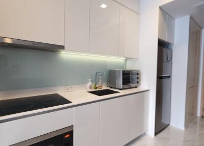 Modern kitchen with built-in appliances and sleek cabinetry