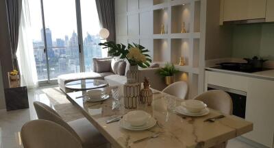 Modern living area with dining table and city view