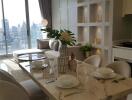 Modern living area with dining table and city view