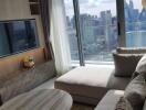 Modern living room with a large window view of the city skyline