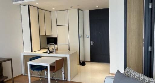 Modern small kitchen area with dining table and chairs