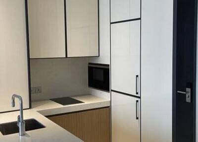 Modern kitchen with integrated appliances and white cabinets