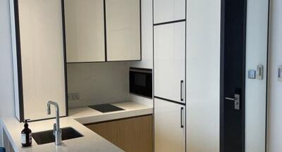 Modern kitchen with integrated appliances and white cabinets