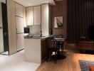 Modern kitchen and dining area with integrated cabinets and wooden accents