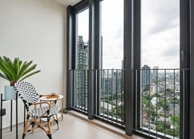 Modern balcony with chairs and a city view