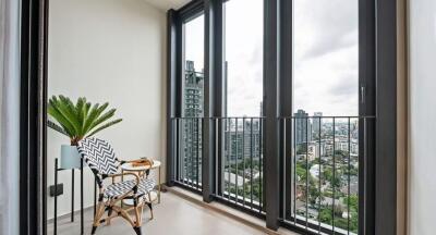 Modern balcony with chairs and a city view