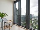 Modern balcony with chairs and a city view