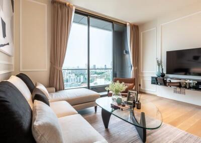 Modern living room with a large window and city view