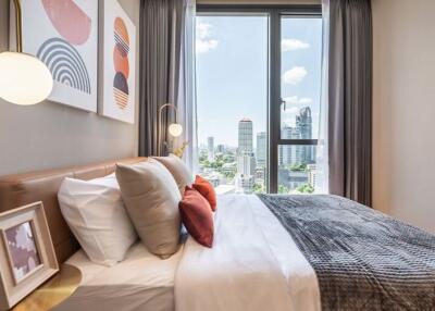 Modern bedroom with large window and city view