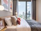 Modern bedroom with large window and city view