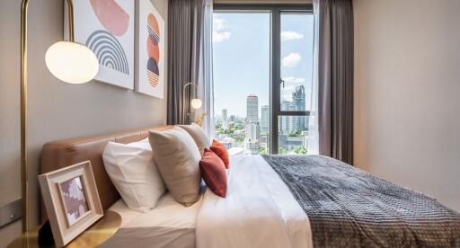 Modern bedroom with large window and city view