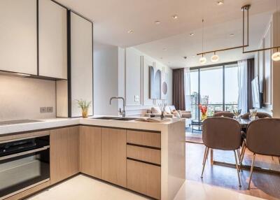 Modern kitchen and dining area with large windows and a city view