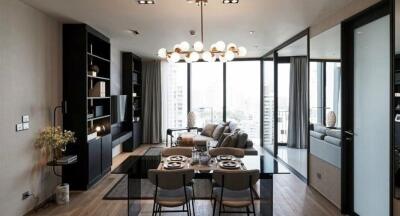 Modern and stylish living room with dining area and large windows