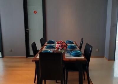 Dining area with a set table and chairs