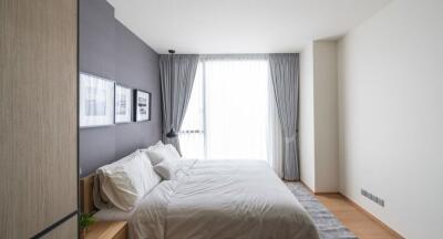 Contemporary bedroom with large window and natural light