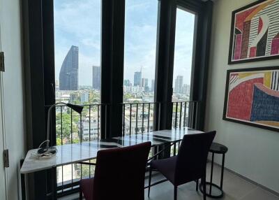 Modern high-rise apartment with city view from a work station