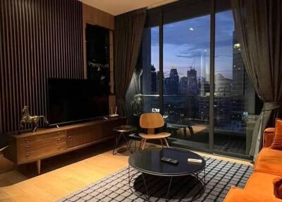 Modern living room with city view at dusk