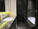 Modern black marble bathroom with illuminated vanity