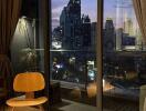 Living room with a view of the city skyline at dusk