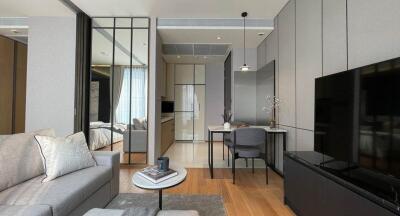 Modern living room with adjoining kitchen and bedroom