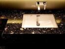 Modern bathroom sink with dark marble countertop