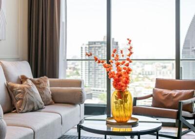 Modern living room with a large window and city view