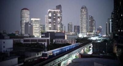 City skyline view with high-rise buildings and a train