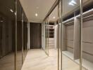 Modern walk-in closet with ample storage and lighting