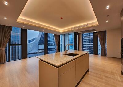 Modern kitchen with island and panoramic city view