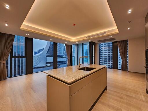 Modern kitchen with island and panoramic city view