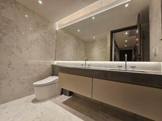 Modern bathroom with marble walls and double sink