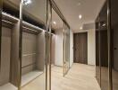 Spacious walk-in closet with floor-to-ceiling mirrors and multiple storage compartments