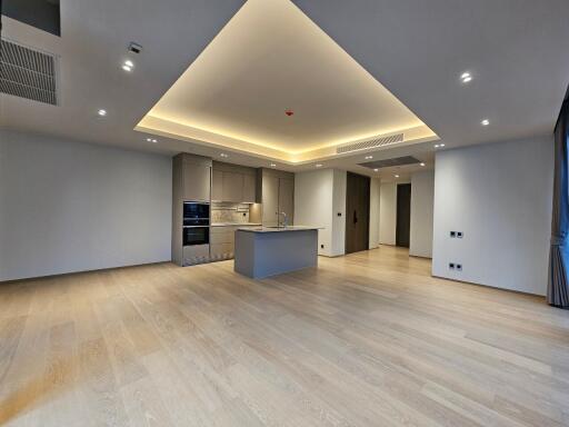 Spacious modern kitchen with central island and recessed lighting