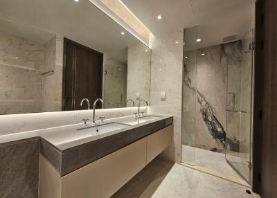 Modern bathroom with double sink and glass shower