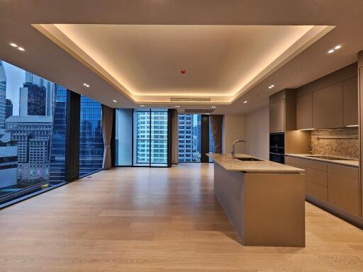Modern kitchen and living area with city views
