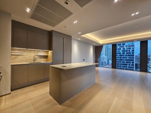 Modern kitchen and living area with large windows