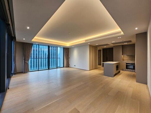 Spacious modern living area with open kitchen and large windows